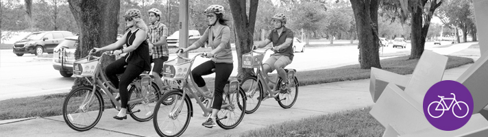 Residents riding bikes on a local bike trail.